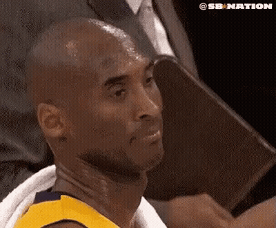 Basketball Player With Towel Around Neck Sitting In Chair GIF