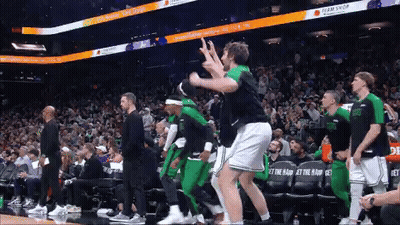Basketball Players Dancing In Front Of Team Shop Seat GIF