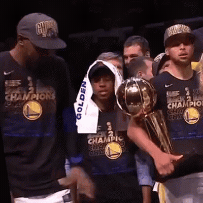 Basketball Players Holding Trophy GIF