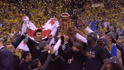 Basketball Players Holding Trophy In Crowd GIF