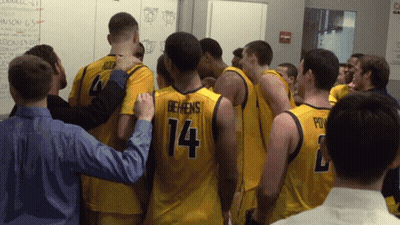 Basketball Players Huddled Including Number 14 GIF