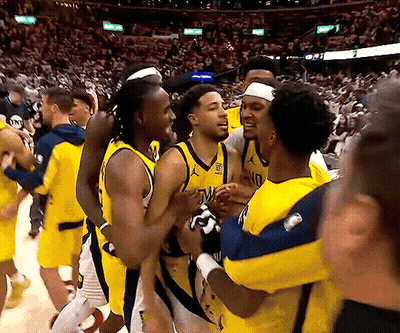 Basketball Players Hugging, One With NC Jersey GIF