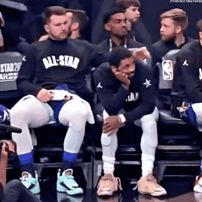 Basketball Players In All Star Shirts Sitting In Stands GIF