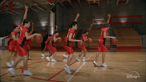 Basketball Players In Red Uniforms With Number 14 GIF