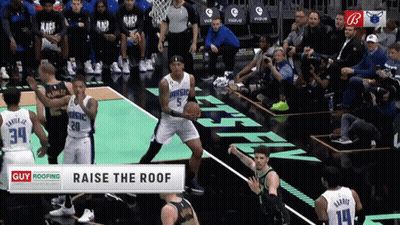 Basketball Players On A Court With A Banner That Says Raise The Roof At The Bottom GIF