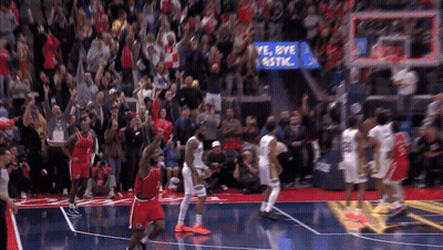 Basketball Players On A Court With A Sign That Says Bye Plastic In The Background GIF