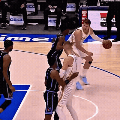Basketball Players On A Court With The Word Geico In The Background GIF