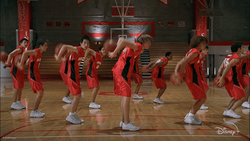 Basketball Players On Court With Disney Plus Logo GIF