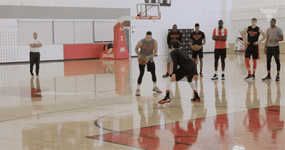 Basketball Players On Court With Spalding Logo GIF
