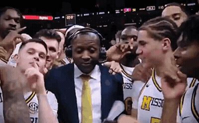 Basketball Players Posing With Man In Headphones GIF