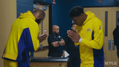 Basketball Players Praying In Locker Room GIF