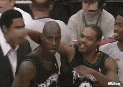 Basketball Players Sitting In Stadium With Timberwolves Jersey GIF