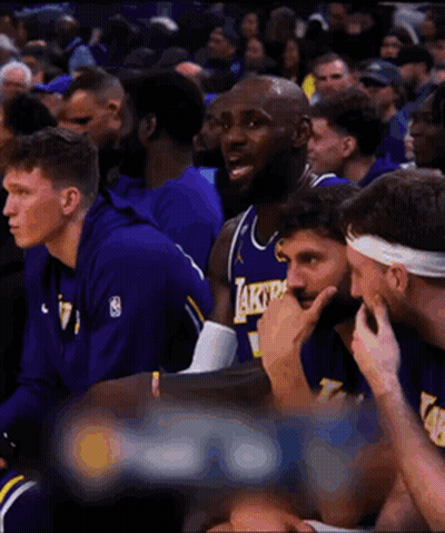 Basketball Players Sitting In Stands Watching Game GIF
