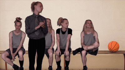 Basketball Players Sitting On Bench With Basketball GIF