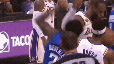 Basketball Players Standing Near Taco Sign GIF