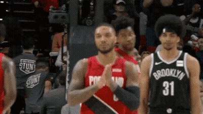 Basketball Players Standing On Court GIF