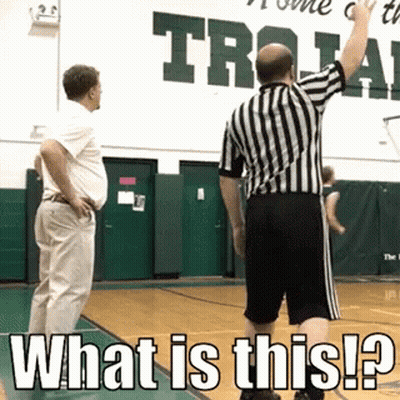 Basketball Referee In Front Of Sign Saying What Is This GIF