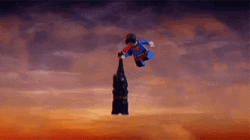 Bat Signal Flying Over Cartoon Superman GIF