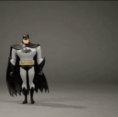 Batman Action Figure Flying Through Air GIF