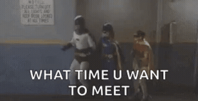 Batman And Batgirl Standing Next To Each Other GIF