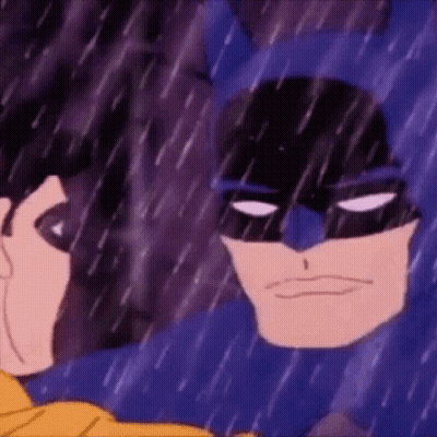 Batman And Robin Are Standing In The Rain Looking At Each Other . GIF