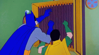 Batman And Robin Are Standing Next To Each Other In Front Of A Cabinet . GIF