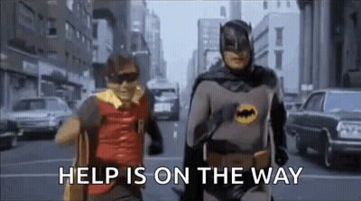 Batman And Robin Running On City Street Saying Help Is On The Way GIF