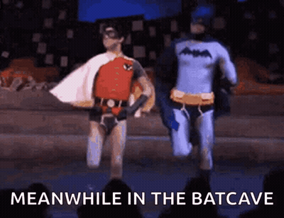 Batman And Robin Running On Stage Meanwhile In The Batcave GIF