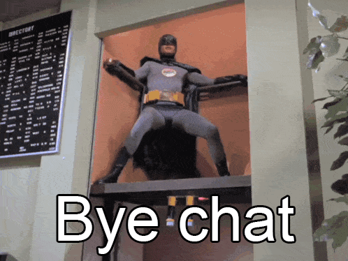 Batman Costume Says Bye Chat In Front Of Directory Sign GIF