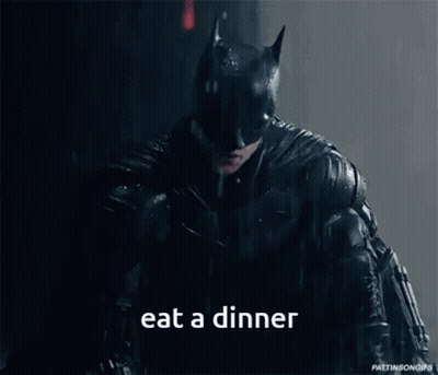 Batman Eating Dinner In The Rain GIF