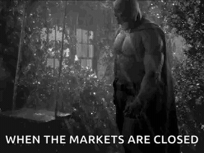 Batman Is Standing In Front Of A Window In A Black And White Photo . GIF