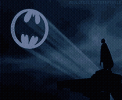 Batman Logo Projected On Sky GIF