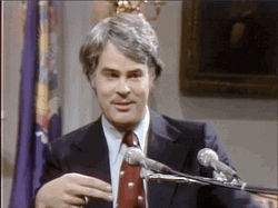 Batting Eyelashes Dan Aykroyd Smile GIF
