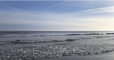 Beach Scene With Waves And Blue Sky GIF