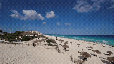Beach With Umbrellas And Chairs GIF