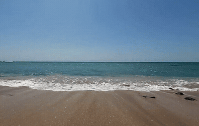 Beach With Waves Crashing And Blue Sky GIF