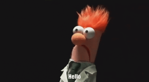 Beaker From The Muppets Is Wearing A Lab Coat And Tie And Saying Hello . GIF