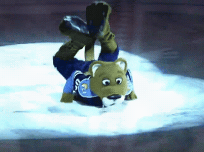 Bear Mascot Laying On Back In Snow GIF