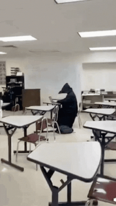 Bear Sitting At Table In Classroom GIF