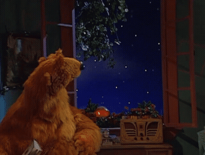 Bear Sitting At Window Looking At Moon With Face GIF