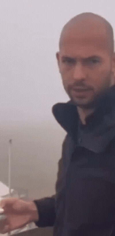 Bearded Bald Man Standing In Front Of Boat GIF