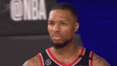 Bearded Basketball Player In Front Of NBA Sign GIF