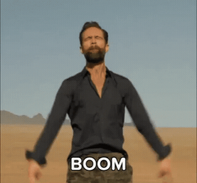 Bearded Man Arms Outstretched Desert With Boom On Chest GIF