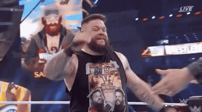 Bearded Man Arms Outstretched Making Face Wrestling Ring GIF