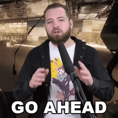 Bearded Man at Microphone Saying Go Ahead