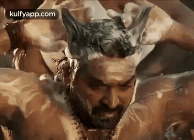 Bearded Man Bathing With Foam On Head GIF
