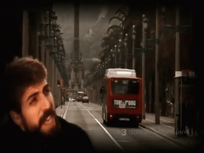Bearded Man Beside Red Bus Saying Tome Pogg GIF