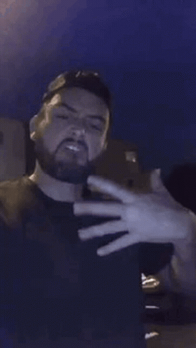 Bearded Man Blowing Smoke GIF