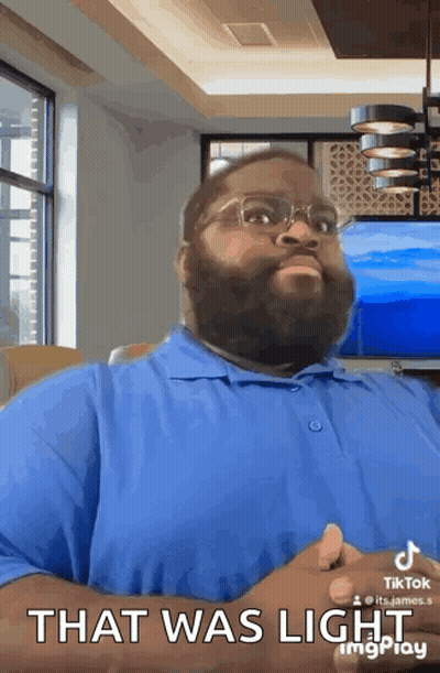 Bearded Man Blue Shirt Glasses Says That Was Light GIF
