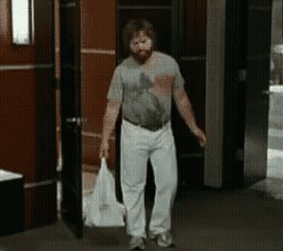 Bearded Man Carrying Bag GIF